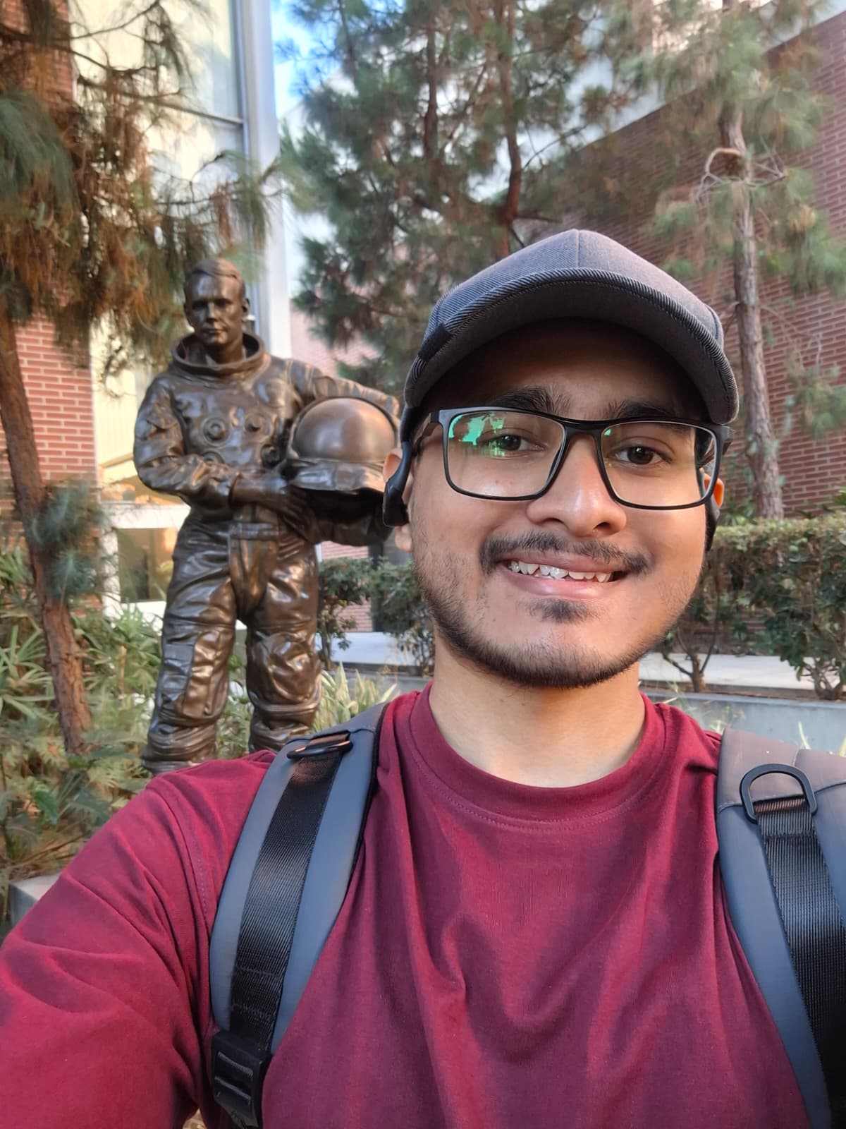 Abrar in front of the Neil Armstrong Statue at USC Viterbi building