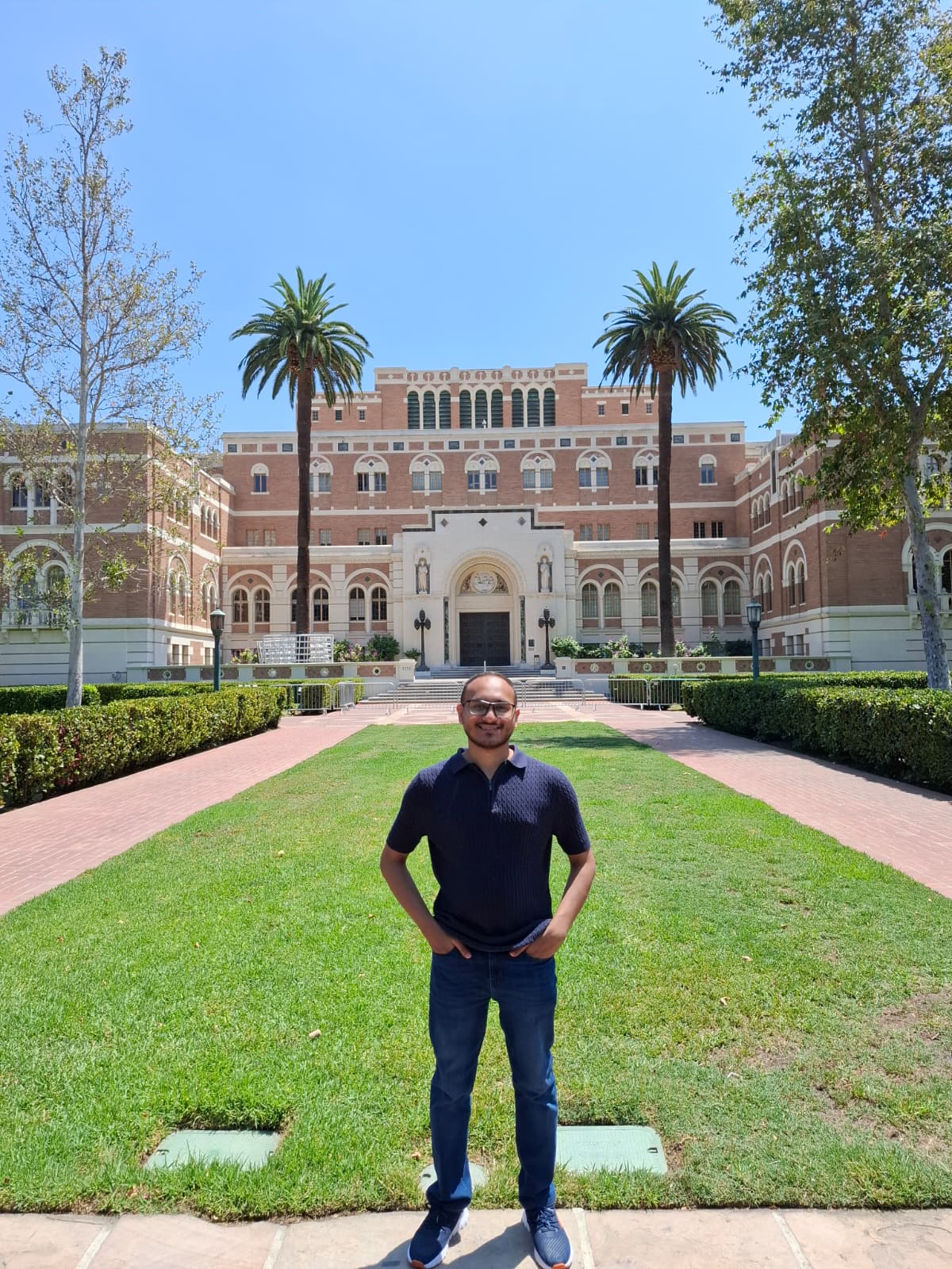Abrar at the entrance of Doheny Memorial Library, USC